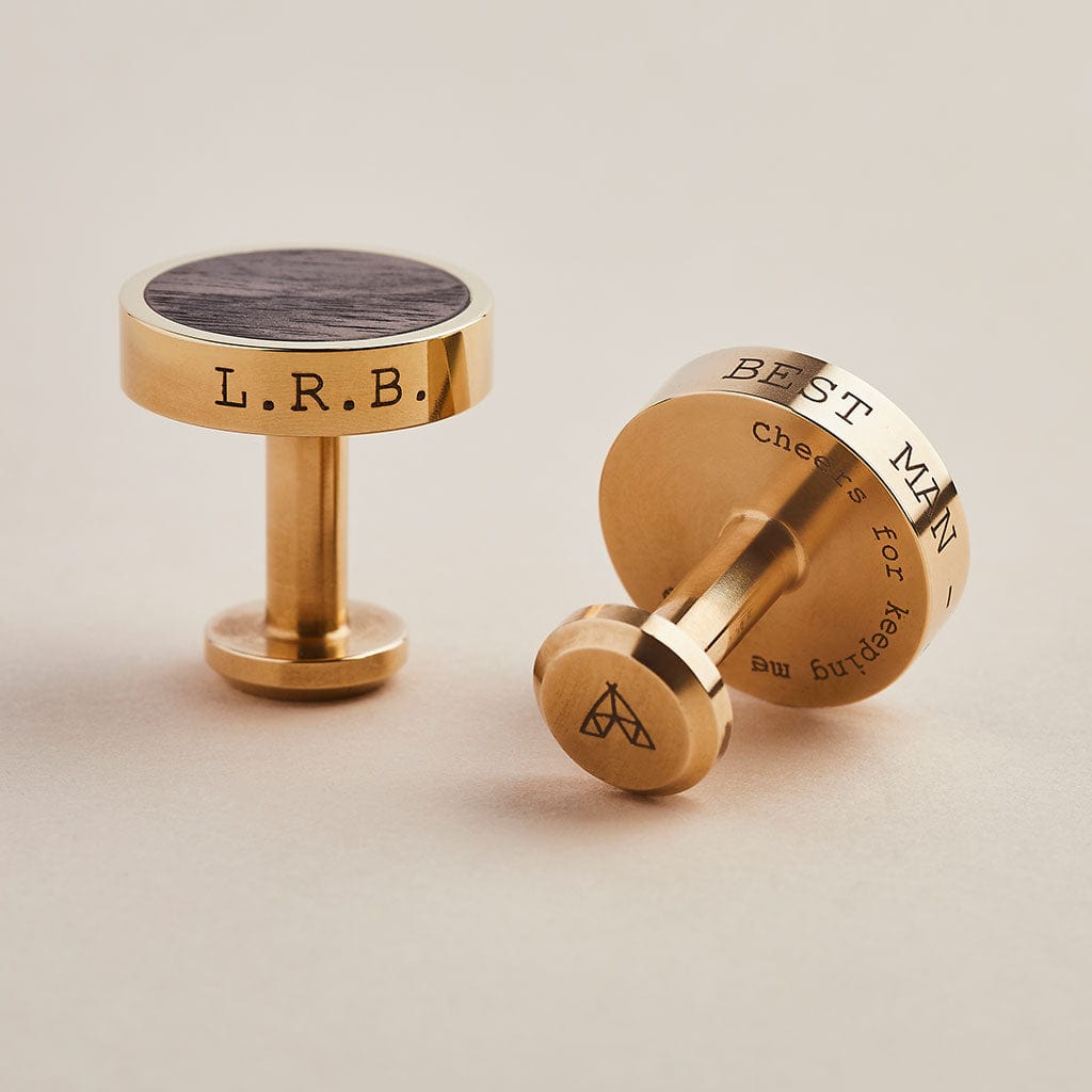 Brass cufflinks engraved with personalised messages, with a dark walnut wood inlay. Made by Man & Bear.