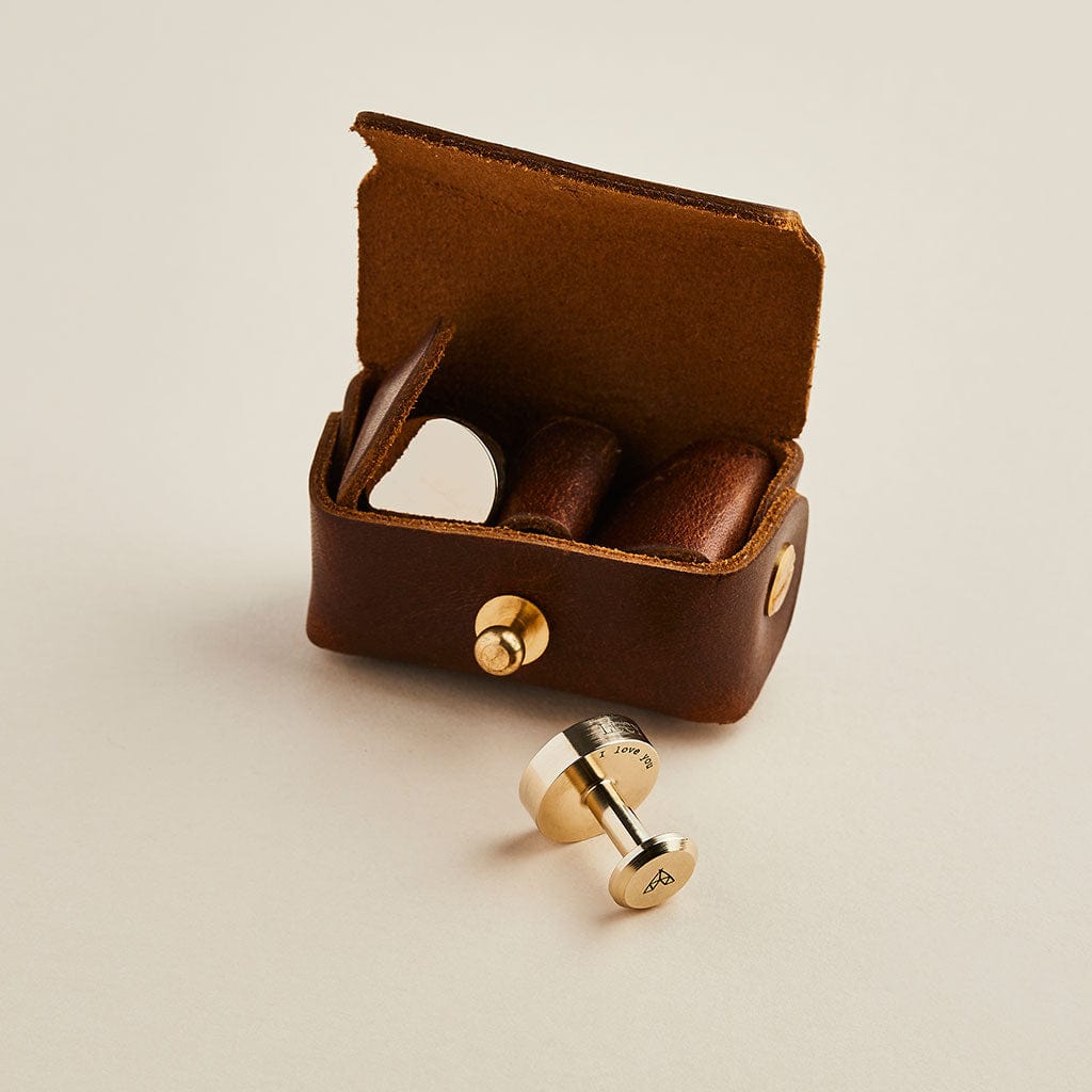 Brown leather cufflink pouch with bronze Man & Bear cufflinks