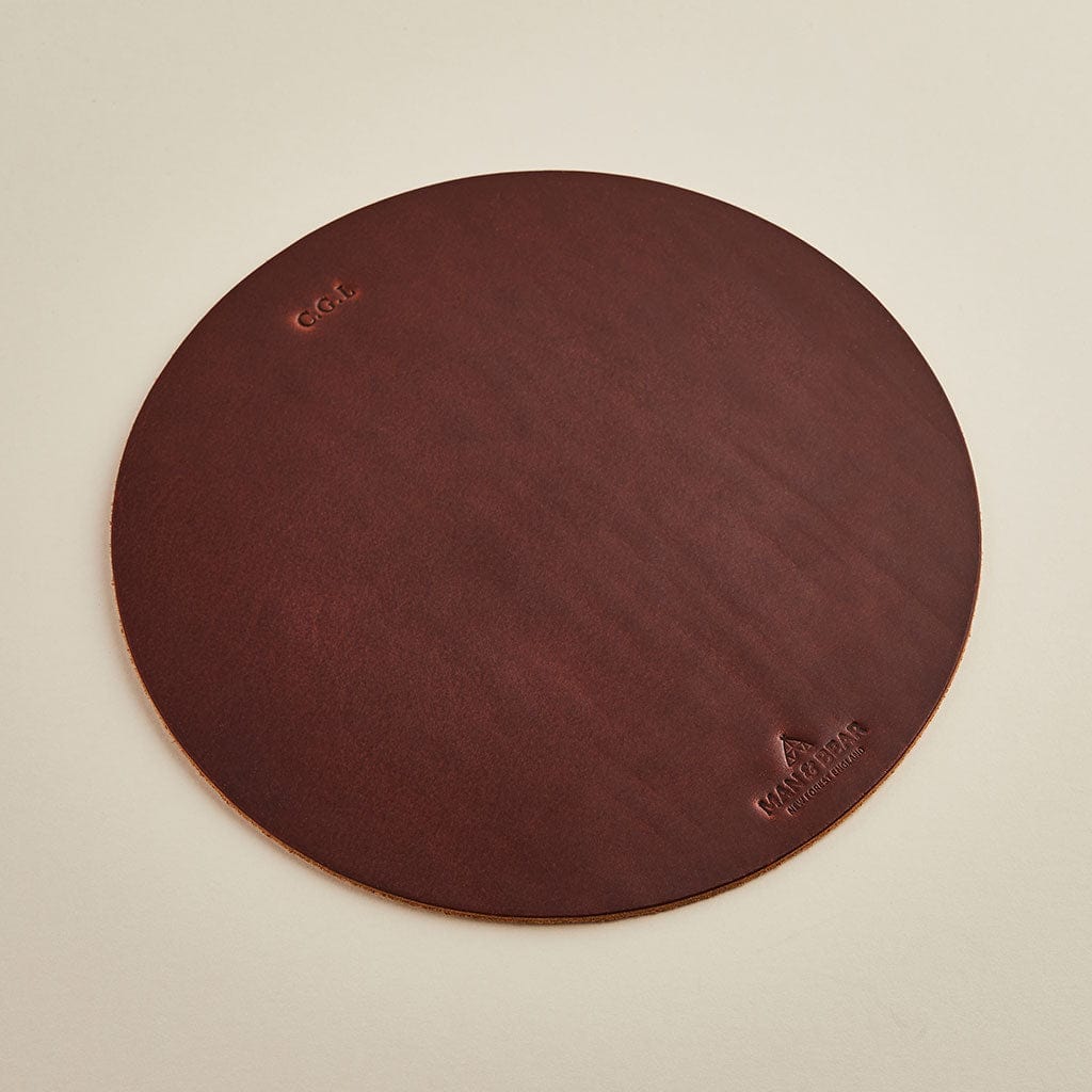 Round brown leather mousemat with personalised initials and the Man & Bear logo