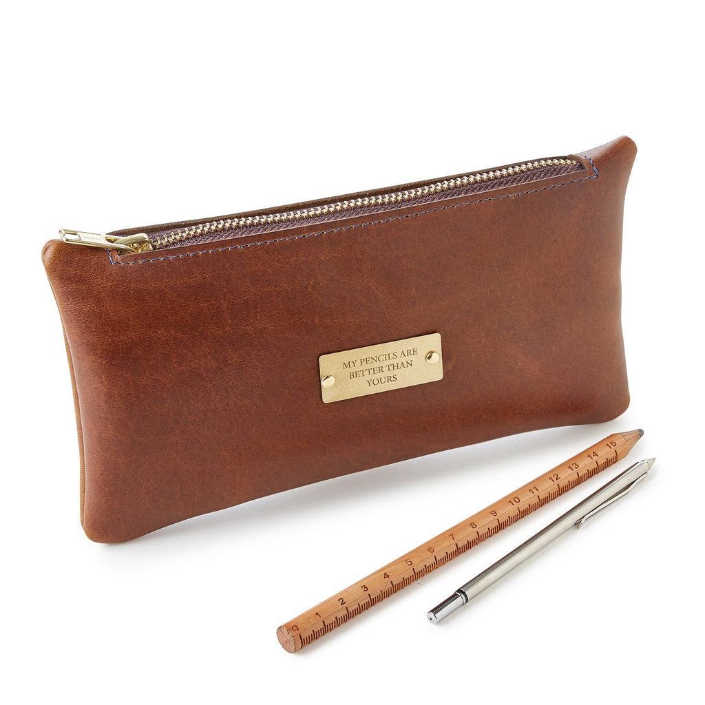 Brown leather pencil case with brass zip, engraved 'my pencils are better than yours' - made by Man & Bear - cut out image