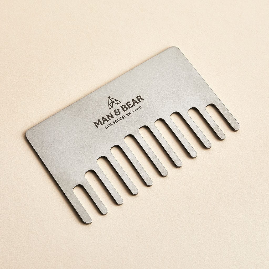 Steel beard comb engraved with the Man & Bear branding