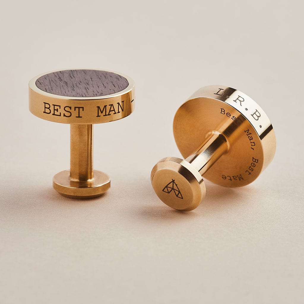 Brass cufflinks engraved with personalised messages, with a dark walnut wood inlay. Made by Man & Bear.