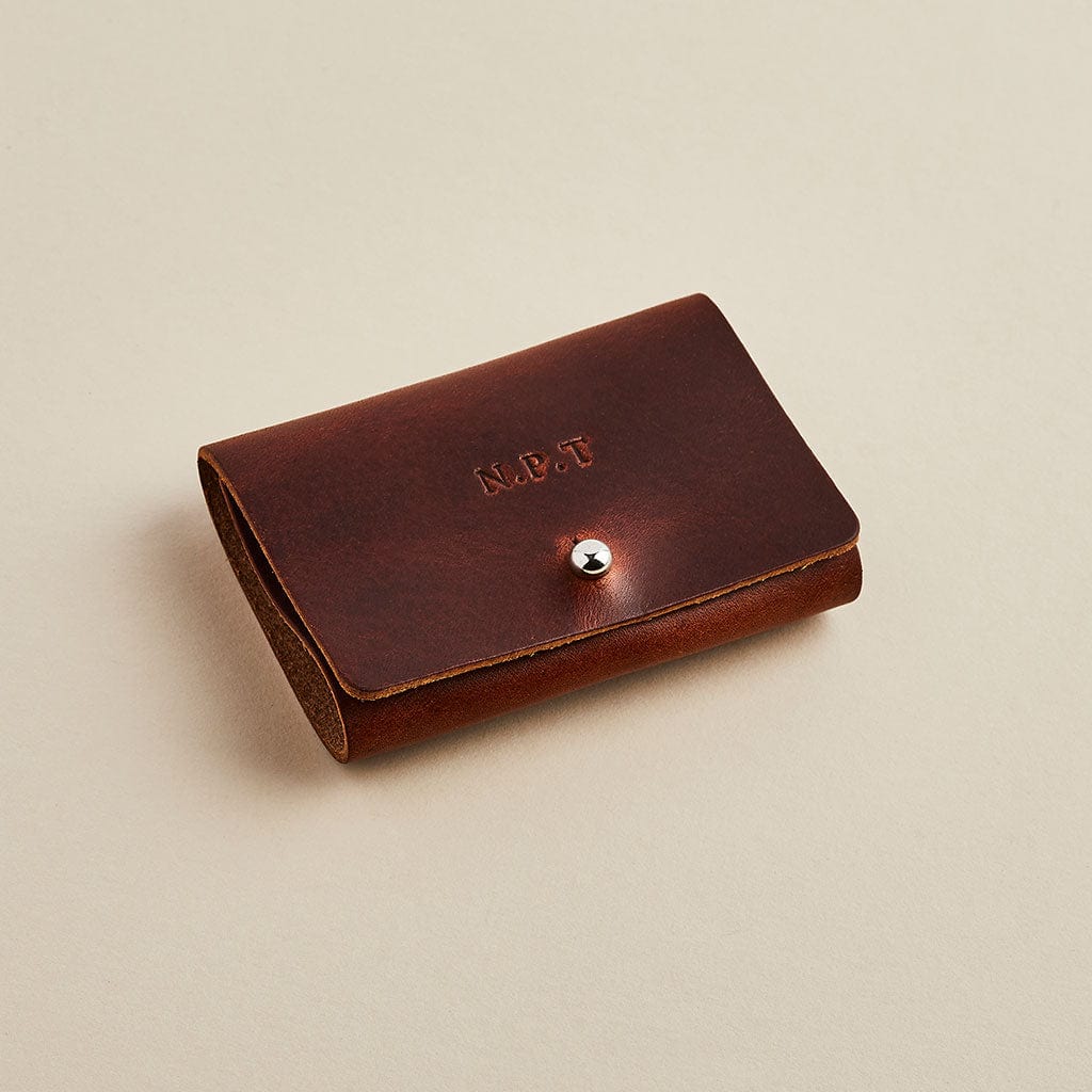 Brown leather storage case for collar stiffeners, personalised with initials