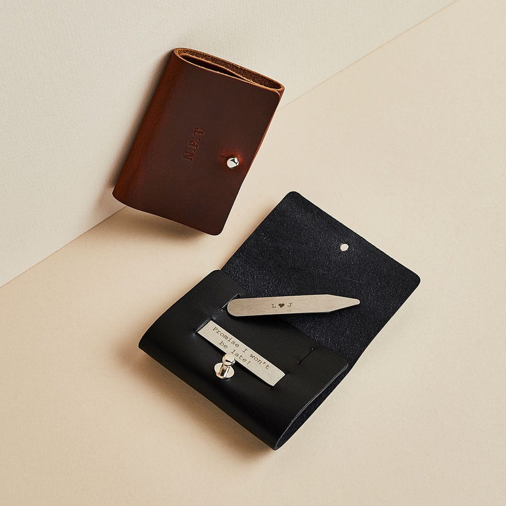 Sets of personalised collar stiffeners in black and brown leather cases, made by Man & Bear