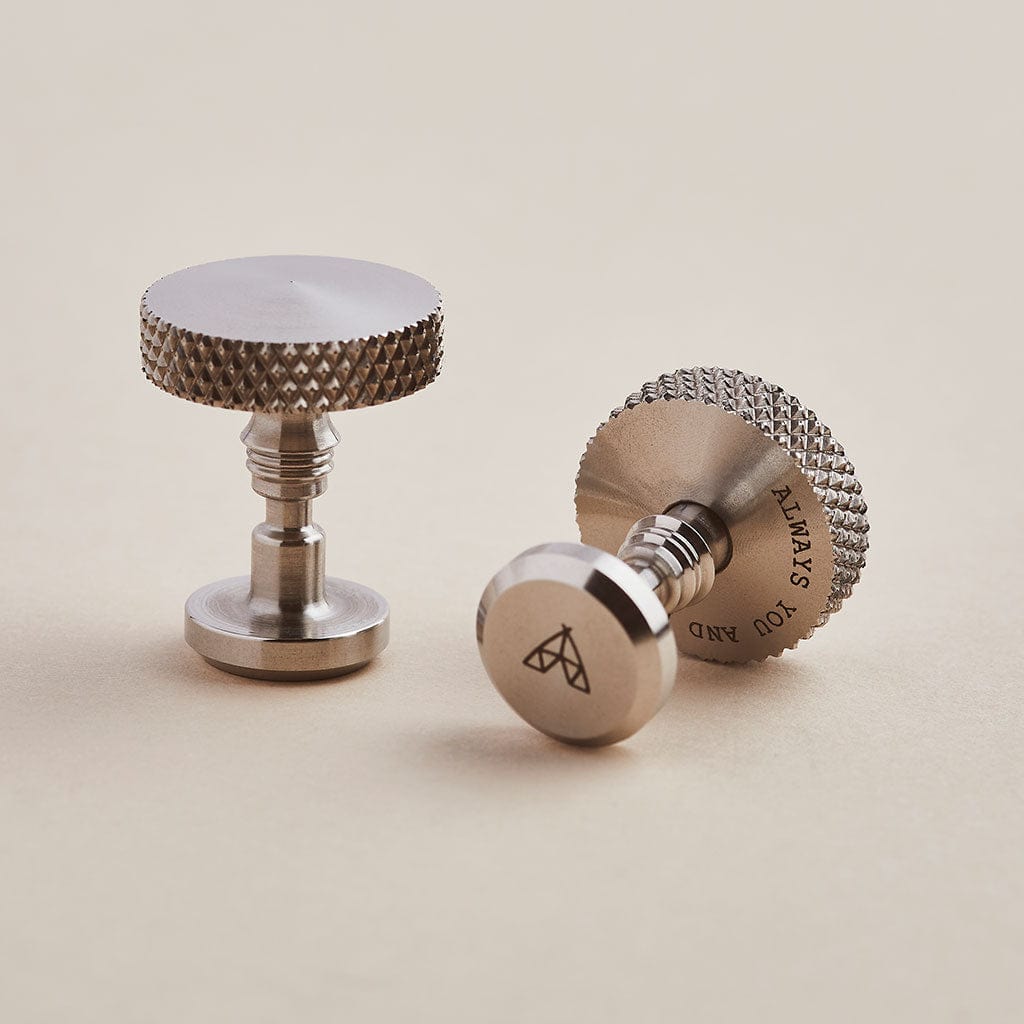 Stainless steel cufflinks with an engraved message and detailed knurled edges - by Man & Bear
