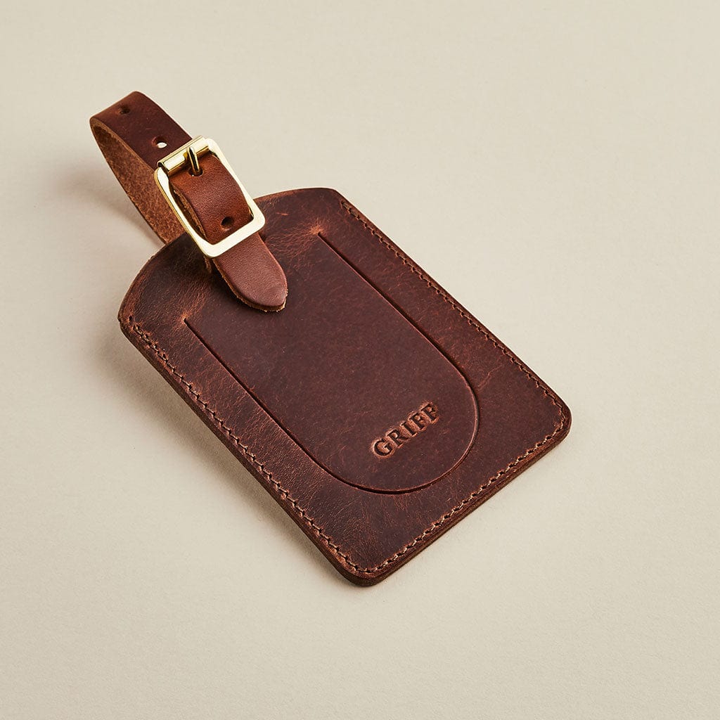 Brown leather luggage tag by Man & Bear, personalised with the name Griff