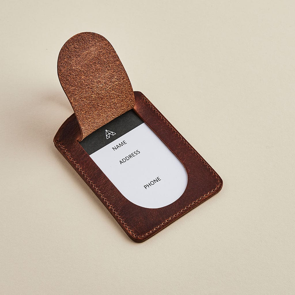 Brown leather luggage tag by Man & Bear