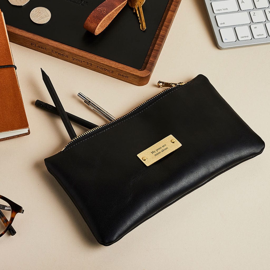 Black leather pencil case with brass zip, engraved 'my pens are mine alone' - made by Man & Bear