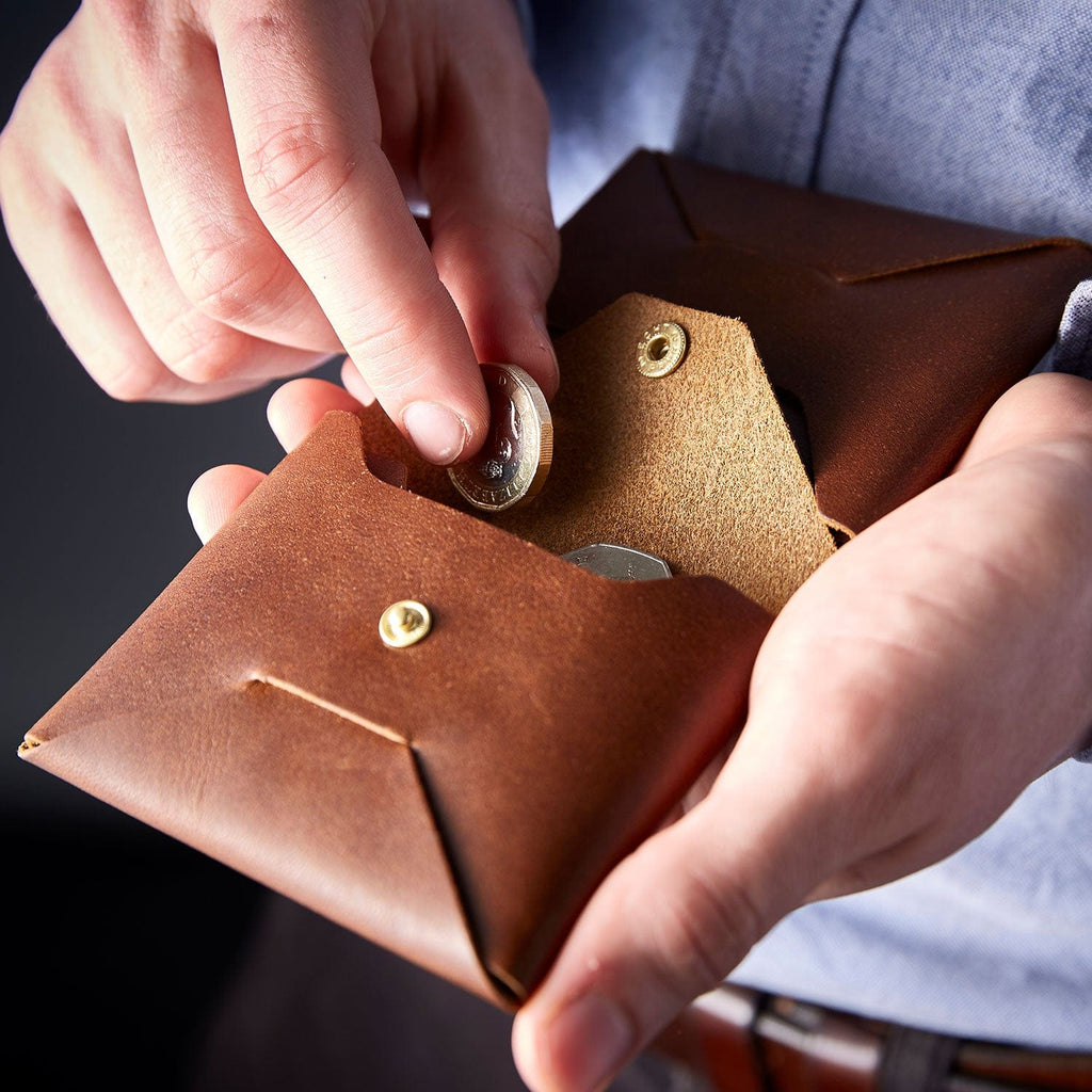 Brown leather origami wallet with coin pocket by Man & Bear, modelled in hand