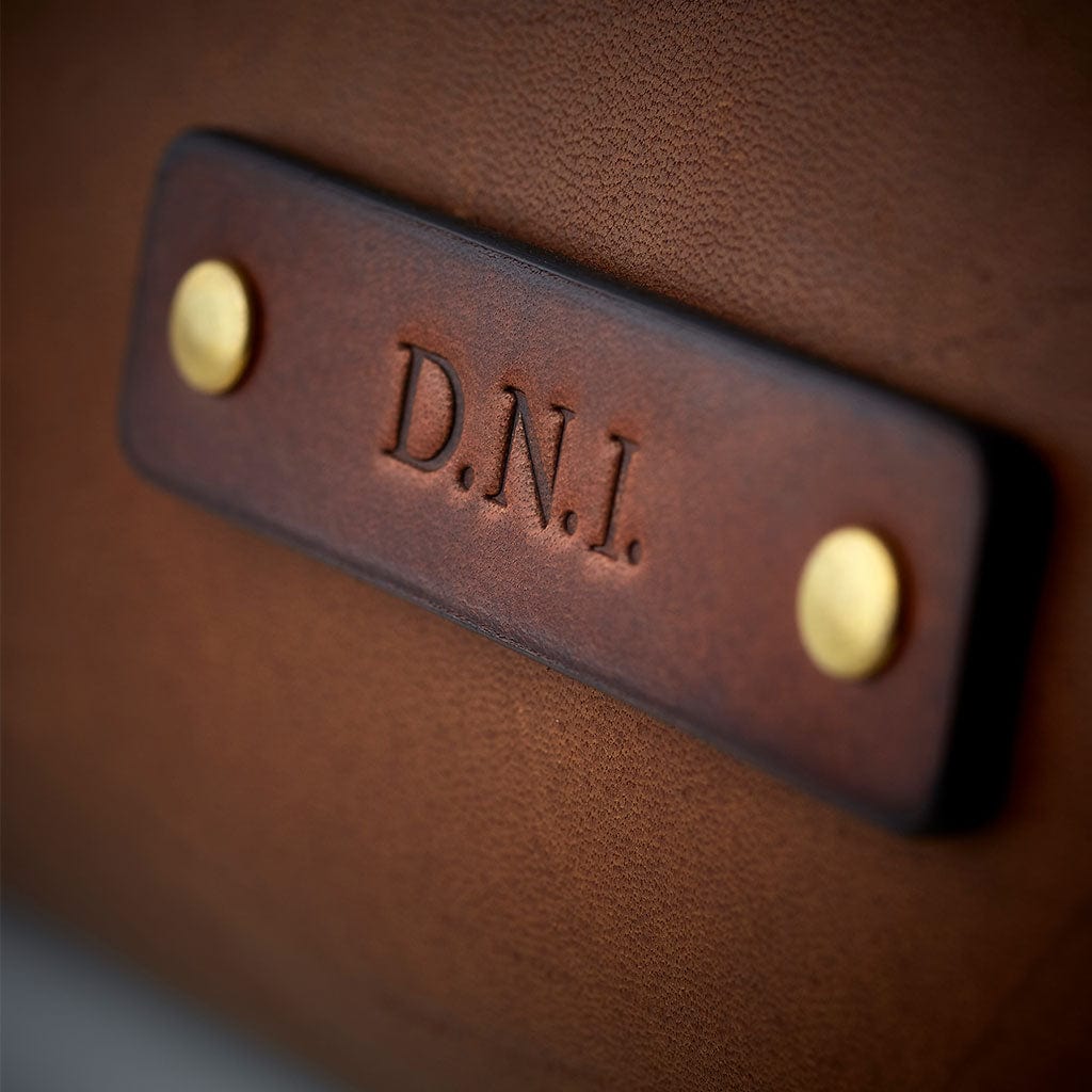 Traditionally debossed initials in leather, by Man & Bear