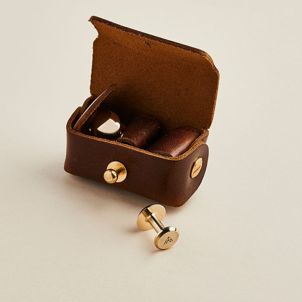 Brown leather cufflink pouch with bronze Man & Bear cufflinks
