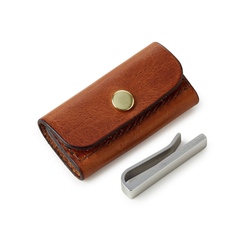 Stainless steel tie bar with brown leather storage pouch, made by Man & Bear